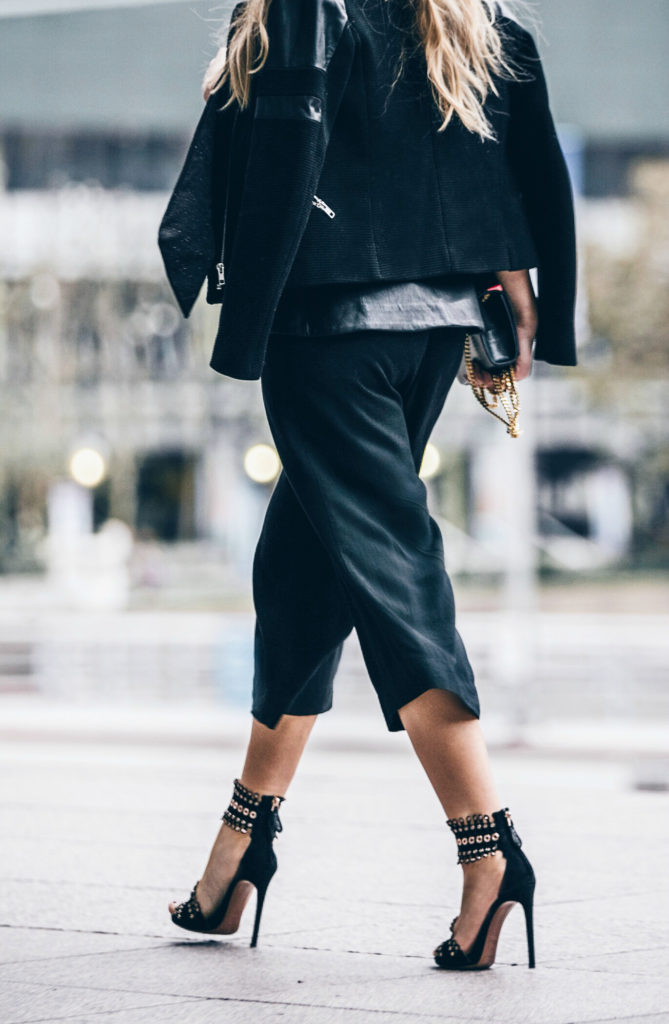 black minimalistic outfit,ALAIA heels,Alaia Sandals,Culottes outfit,YSL MONOGRAM BAG,How to wear culottes,the row sound sunglasses,finders keepers bustier,dolan t-shirt,dior fluid stick in Trompe L’Oeil,Sandro jacket,ysl bag,saint laurent bag