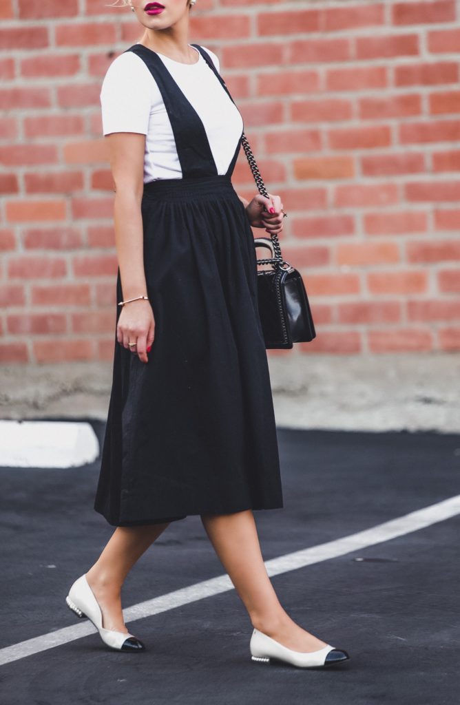 Suspender dress,Urban outfitters apron dress,theory white t-shirt,Urban outfitters suspender dress,Chanel flats,How to style white t-shirt,Chanel chain Boy bag,Chanel pearl flats,pinafore dress,Silence + Noise Camden Apron Midi Skirt,the row 8 sunglasses, miansai 