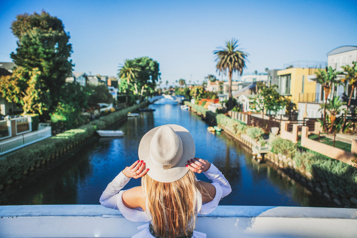Venice canals view from the bridge,Venice Canals,Venice Canals colors,Maison michel straw hat,Venice canals pastels,balenciaga basket tote,Balenciaga straw bag,Venice canals bridges,Milly palm tree skirt,Jonathan Simkhai cold shoulder top,Venice canals California,Natural beige straw Henrietta hat from Maison Michel,Milly Palm Tree Print Cady Midi Skirt,Pretty venice canals,Colorful venice canals,balenciaga panier basket tote,Proenza Schouler's cutout mules,Balenciaga Bistro Cabas