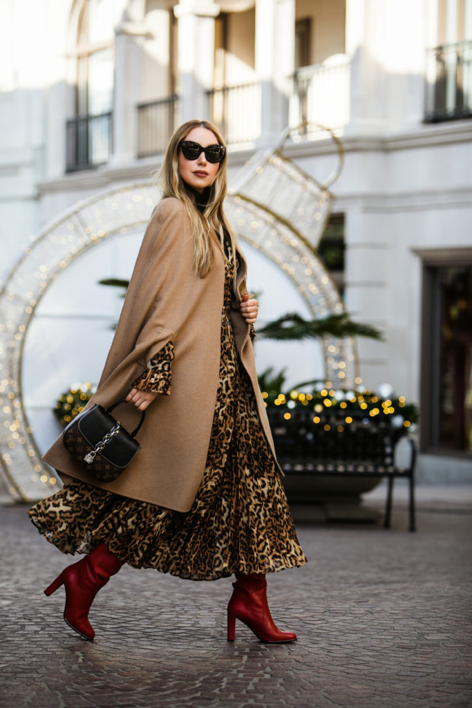 Loewe earrings,Louis Vuitton CHAIN IT BAG PM,Louis Vuitton CHAIN IT LOCK BAG,leopard print with camel coat,H&M pleated leopard dress,How to wear red boots winter 2019,FRATELLI ROSSETTI tubular boots,Christmas 2018 on Rodeo drive,How to wear cape 2019,H&M Leopard Wrap Dress,H&M Jacquard-weave Wrap Dress,How to style cape 2019,Oscar de la Renta camel cape,Louis Vuitton CHAIN IT BAG,FRATELLI ROSSETTI red boots