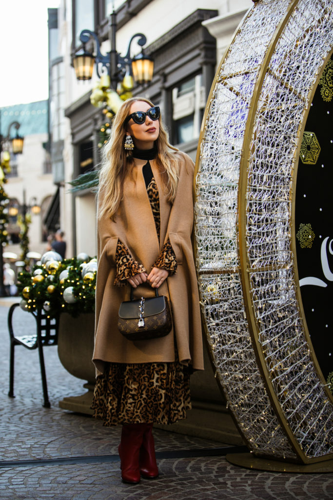 Loewe earrings,Louis Vuitton CHAIN IT BAG PM,Merry Christmas '18!,Louis Vuitton CHAIN IT LOCK BAG,leopard print with camel coat,H&M pleated leopard dress,How to wear red boots winter 2019,FRATELLI ROSSETTI tubular boots,Christmas 2018 on Rodeo drive,How to wear cape 2019,H&M Leopard Wrap Dress,H&M Jacquard-weave Wrap Dress,How to style cape 2019,Oscar de la Renta camel cape,Louis Vuitton CHAIN IT BAG,FRATELLI ROSSETTI red boots